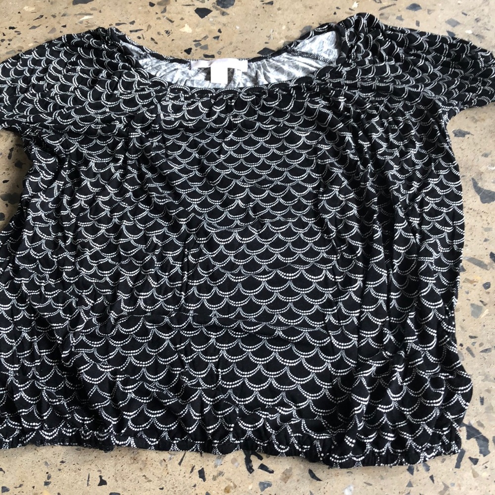 Michael Kors black top with white design.